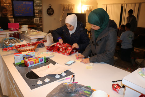 Volunteers wrapping gifts