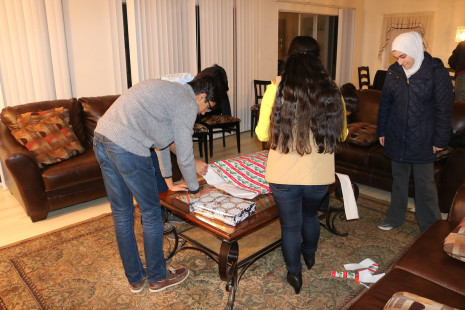 Volunteers wrapping gifts