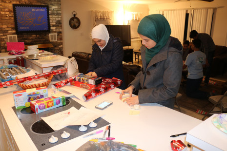 Volunteers wrapping gifts