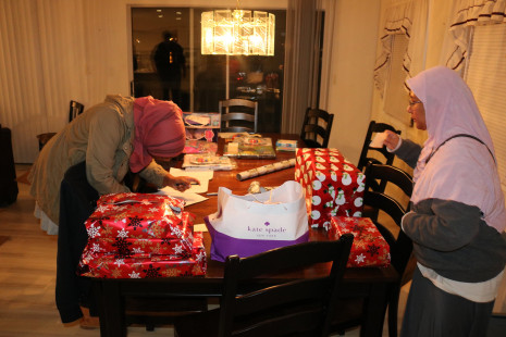 Volunteers wrapping gifts